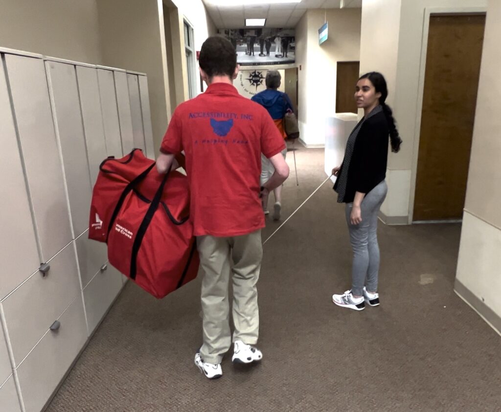 BISM staff member Juhi escorts Red Cross Instructor to the training area