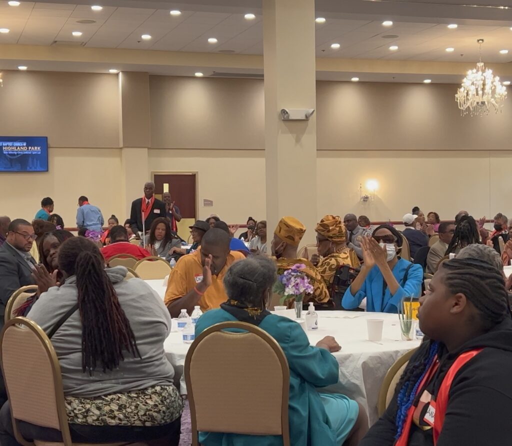 The Disability Forum Conference. People seated at large round tables that seat 10 individuals. All of the tables are full