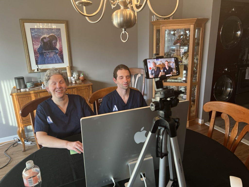 First Aid Ally, on a zoom call, presenting first aid education to a group of blind and visually impaired seniors.
